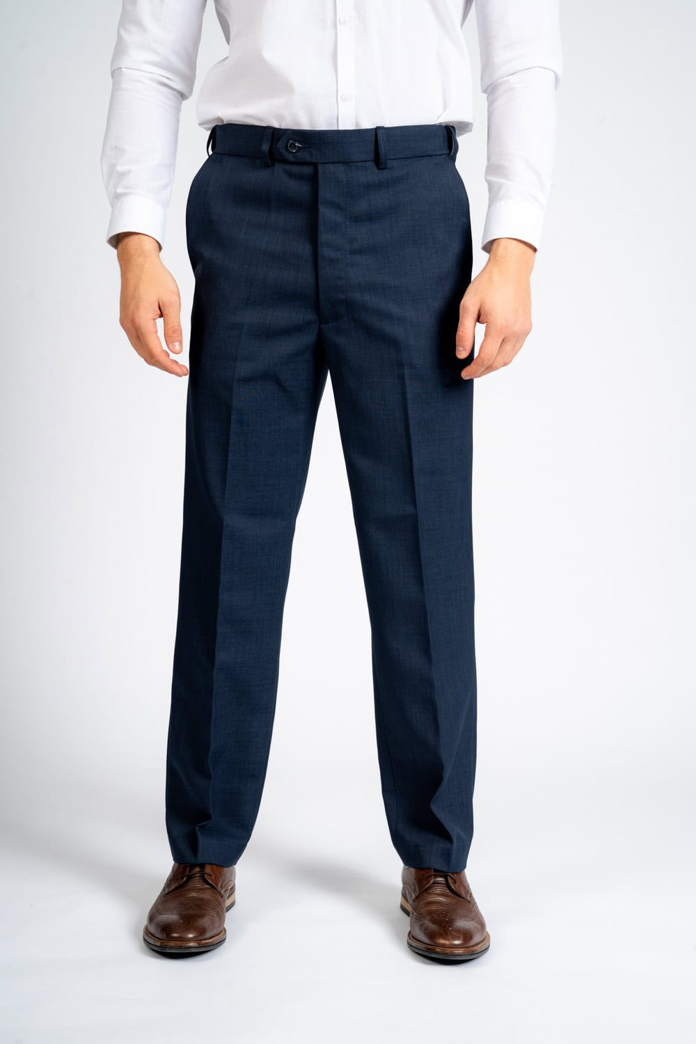 Front view of a person wearing navy blue elastic waist pants for men, styled with a white dress shirt and brown leather dress shoes, showcasing a smart tailored fit and all-day comfort.
